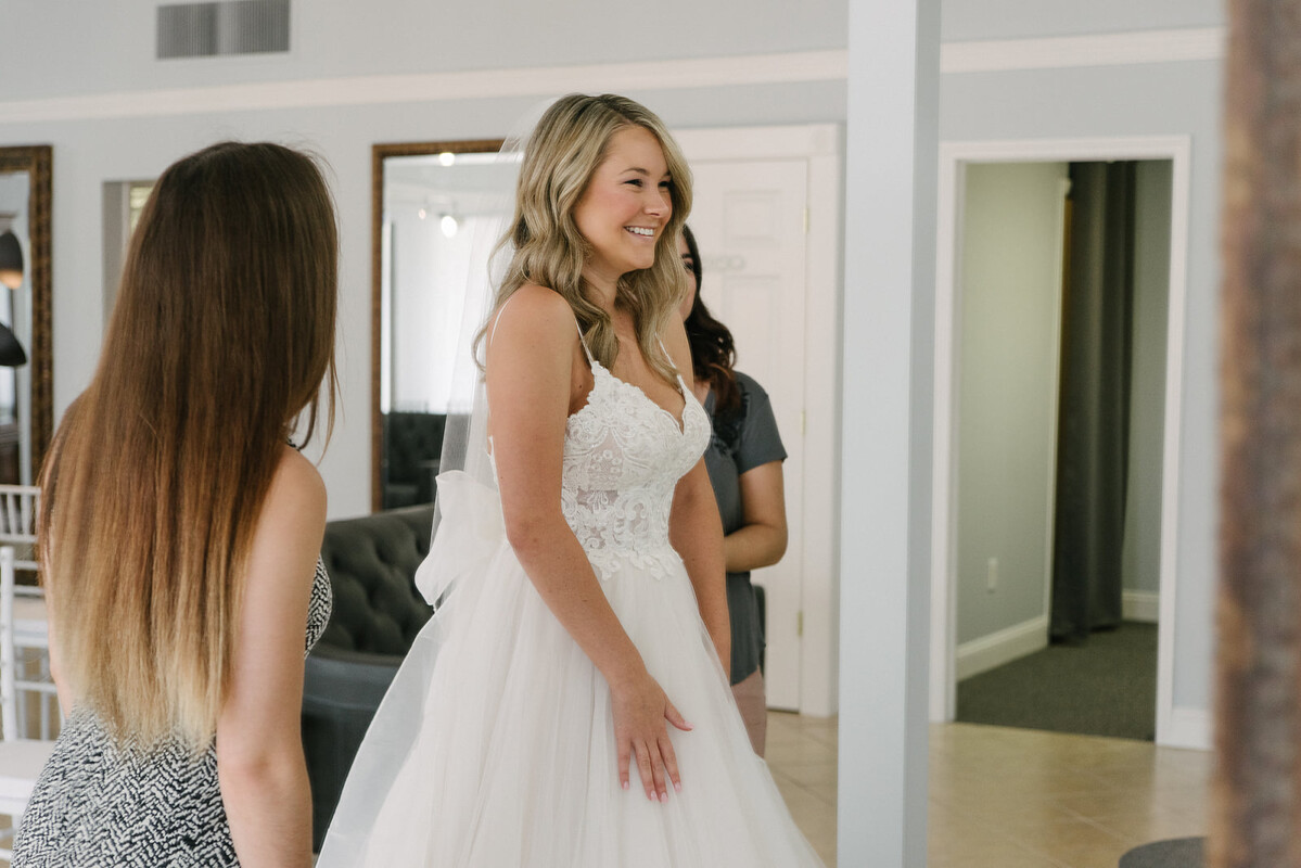 A bride trying on a wedding gown at a Reading Bridal District boutique